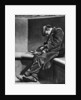 A man sleeping on Blackfriars Bridge, London by Walter Benington