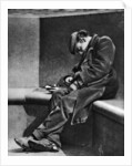 A man sleeping on Blackfriars Bridge, London by Walter Benington