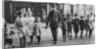 Policeman helping schoolchildren across the road, East End, London by Anonymous