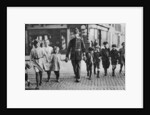 Policeman helping schoolchildren across the road, East End, London by Anonymous
