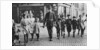 Policeman helping schoolchildren across the road, East End, London by Anonymous