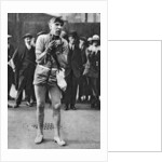 Escapologist entertaining theatre-goers in the 'pit' queue, London by Anonymous