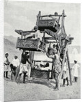 Arabian children enjoying a 'big-wheel' by Anonymous