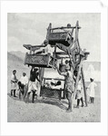 Arabian children enjoying a 'big-wheel' by Anonymous