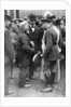 King George V and Queen Mary with a shipwright, Birkenhead, First World War by Anonymous