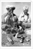 Charming the venom from a cobra; a snake charmer with a mongoose, India by JH Powell