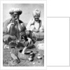 Charming the venom from a cobra; a snake charmer with a mongoose, India by JH Powell