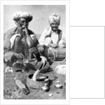 Charming the venom from a cobra; a snake charmer with a mongoose, India by JH Powell
