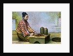 A Burmese woman making cigars by Anonymous