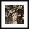 A woman Shinto devotee counting the stone lanterns, Kasuga Shrine, Nara, Japan by Underwood & Underwood