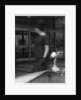 Woman walking past a Rolls-Royce by Anonymous
