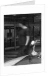 Woman walking past a Rolls-Royce by Anonymous