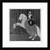 A woman sitting on a rearing horse by Aubrey Beardsley