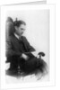 Man sitting in a chair reading a book by Anonymous