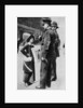 A suffragette confronting two policemen by Sport & General