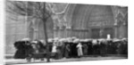 People waiting in the rain in order to attend a service at Westminster Abbey, London by Anonymous