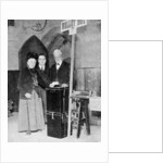 A woman recording her vote at the ballot box by Anonymous