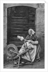 A woman at a spinning wheel, Dinan, Brittany, France by Anonymous