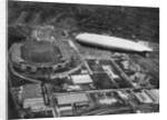 German airship 'Graf Zeppelin' flying over Wembley during the FA Cup Final, London by Central Press