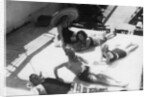 Passengers sunbathing on board a cruise ship by Anonymous
