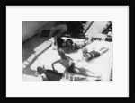 Passengers sunbathing on board a cruise ship by Anonymous