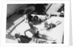 Passengers sunbathing on board a cruise ship by Anonymous