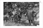 Tourists posing alongside a man with reindeer, Lyngen, Norway by Anonymous