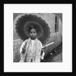 Young Burmese woman holding a huge cigar, Rangoon, Burma by Stereo Travel Co
