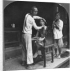 A Chinese barber at Bhamo, Burma by Stereo Travel Co