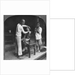 A Chinese barber at Bhamo, Burma by Stereo Travel Co