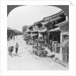 Main business street of the Chinese quarter, Bhamo, Burma by Stereo Travel Co