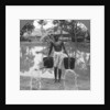 Watering cans used for street sprinkling, Burma by Stereo Travel Co