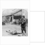 The grim executioner taking the labled head to exhibit a warning by Underwood & Underwood