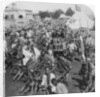 Wheelbarrow transportation at the boat landing by Underwood & Underwood