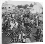 Wheelbarrow transportation at the boat landing by Underwood & Underwood