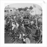 Wheelbarrow transportation at the boat landing by Underwood & Underwood