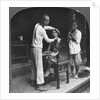 A Chinese barber at Bhamo, Burma by Stereo Travel Co