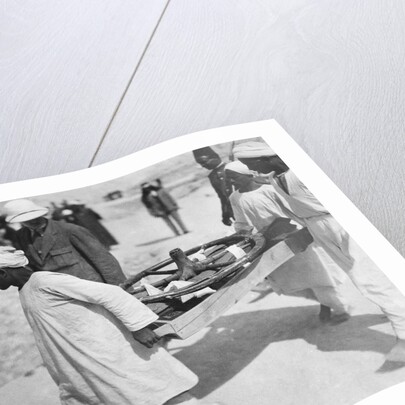 Removing a chariot wheel from the Tomb of Tutankhamun by Harry Burton