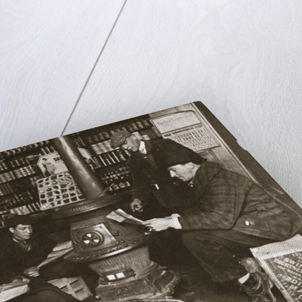 A group of men around a stove in a shop by Anonymous