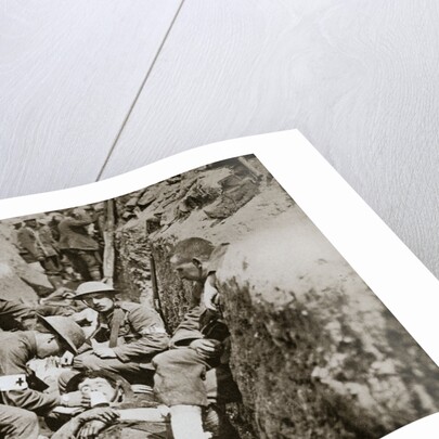 Red Cross men in the trenches tend a wounded man by Anonymous