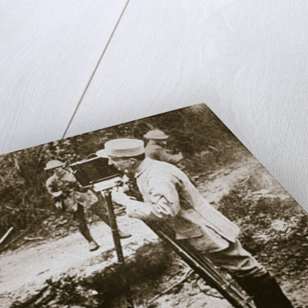 Cameraman filming a wounded soldier by Anonymous