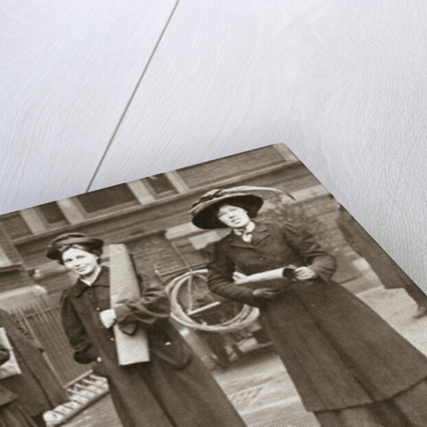 Suffragettes armed with materials to chain themselves to railings by Anonymous