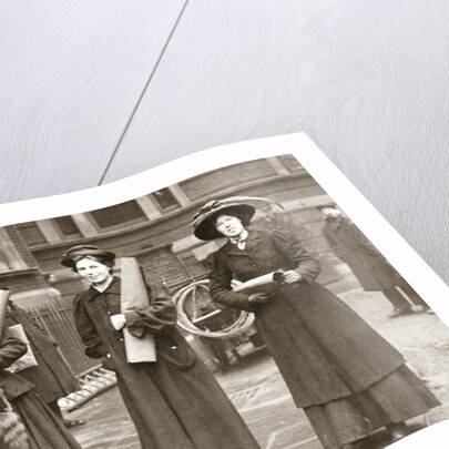 Suffragettes armed with materials to chain themselves to railings by Anonymous