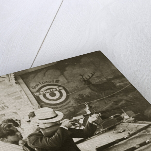 Shooting gallery at the amusement park by Anonymous