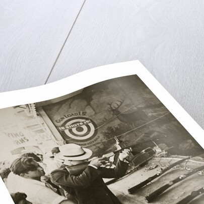 Shooting gallery at the amusement park by Anonymous