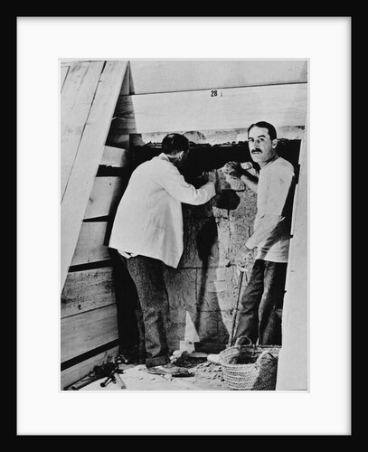 Howard Carter and a colleague excavating a tomb in the Valley of the Kings by Harry Burton
