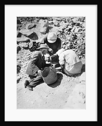 Sifting the dust from the floor of the Tomb of Tutankhamun by Harry Burton