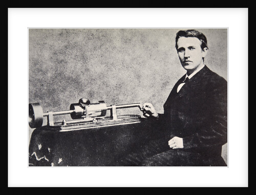 Thomas Alva Edison sitting beside his invention, the phonograph by Anonymous