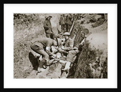 Red Cross men in the trenches tend a wounded man by Anonymous