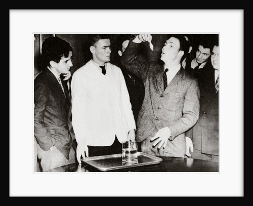 Lothrop Withington, Jr (right), a Harvard freshman, swallowing a goldfish by Anonymous